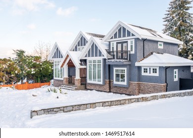 A Typical American House In Winter. Snow Covered.