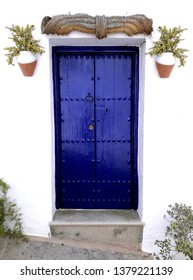 typical Andalusian white village facade and door,