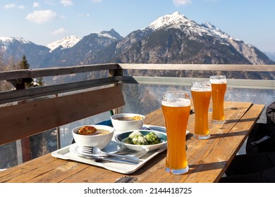 Typical Austrian food in Alpengasthaus Karwendel, located in Alpensee, Tyrol, Austria, near Innsbruck. Food includes beer, spinach dumpling (Spinatknödel) and potato poup (Kartoffelsuupe).