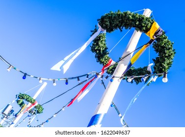 typical bavarian maypole in front of blue sky