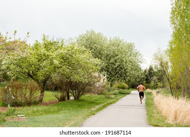 Typical Bike Trail With Paved Path In Suburbia.