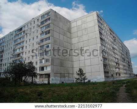 Typical Blocks of Flats Built During Communism Period in Odessa, Ukraine. Facade of a grey multi-storey soviet panel building. Soviet old urban residential houses. Typical ukrainian neighborhood.