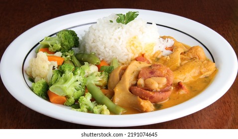 Typical Brazilian Food  Dobradinha, Tripe,   Rice, Beans, Sausage And Vegetables.