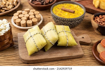Typical brazilian june festival food over wooden table. Festa junina. - Shutterstock ID 2142929719