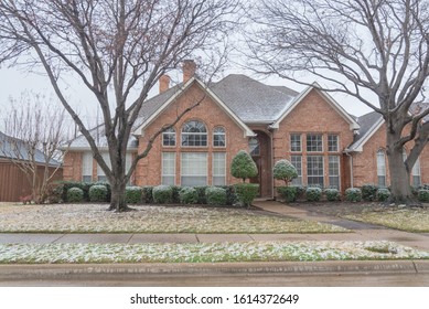 Typical Bungalow House Under Winter Snow Cover Near Dallas, Texas. Middle Class Residential Home In America.