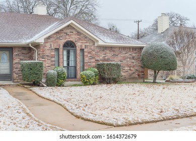 Typical Bungalow House Under Winter Snow Cover Near Dallas, Texas. Middle Class Residential Home In America.