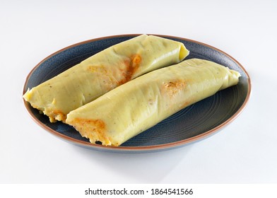 typical chicken tamale on a plate isolated