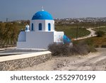 Typical church with blue cupola between Emporio and Akrotiri, Santorini island, Greece