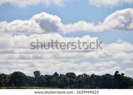 typical cloudy day as nimbus clouds form in rows during the morning in the South Burnett, Queensland, Australia