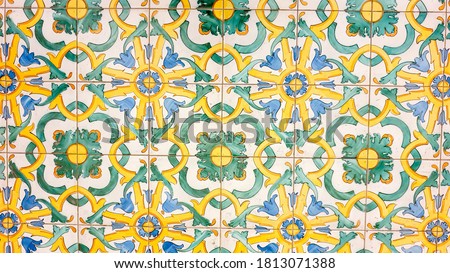 typical colorful sicilian floor and wall tiles in different patterns and design with yellow, white, green and blue colors