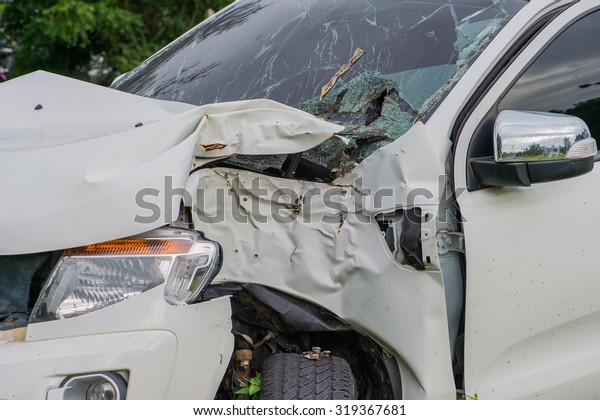 Typical compact car Corruption\
Car crash accident wreck - insurance concept broken glass of a car\
accident several cars collided in a traffic accident . High\
speed\
