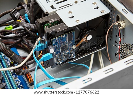 Typical connection of a hard drive using SATA cables, blue cable is SATA data, and the connector from below is the power SATA cable.
