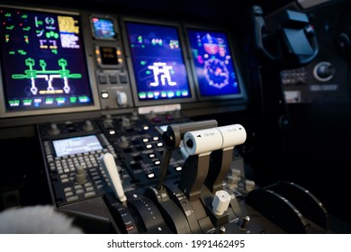 A Typical Dashboard Panel In The Cockpit Of A Private Jet Plane Aircraft. Throttle Control Lever In Focus.