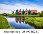 Typical Dutch Scene in Volendam, with a Canal and an Old Windmill