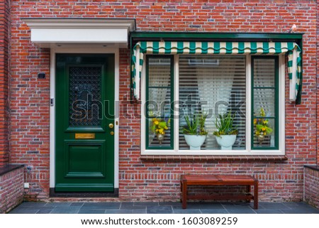 Typical Dutch village houses facade. Beautiful and authentic style at Volendam. North Holland, Netherlands.
