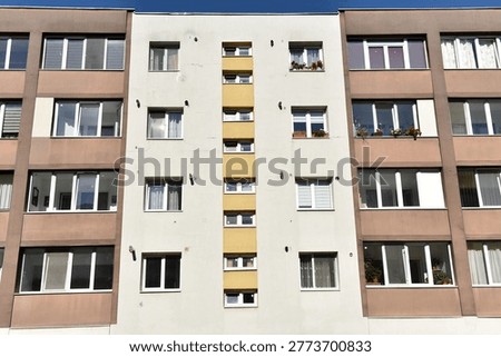 Typical facade of concrete panel building. Post Soviet flat of blocks