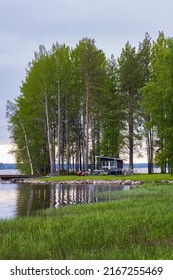 Typical Finnish Little Wooden House Along Lake At The Countryshide