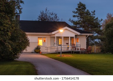 Typical Finnish style countryside house at night. Cozy summer house at night in Finland