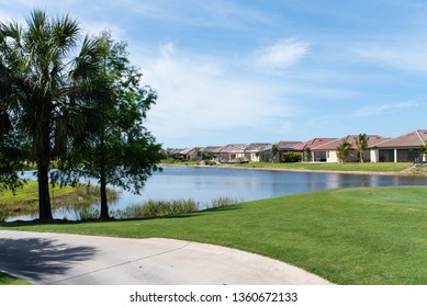 Typical Florida Golf Community Background With Golf Course And Pond.