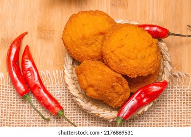 Typical Food From Bahia Called Acarajé Surrounded By Red Peppers And Vatapá