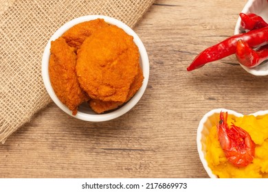 Typical Food From Bahia Called Acarajé Surrounded By Red Peppers And Vatapá