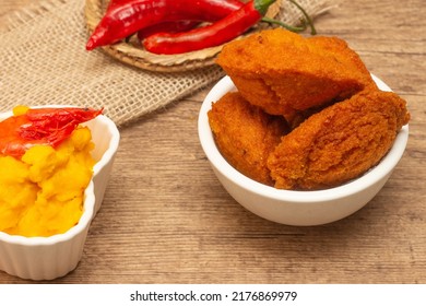 Typical Food From Bahia Called Acarajé Surrounded By Red Peppers And Vatapá