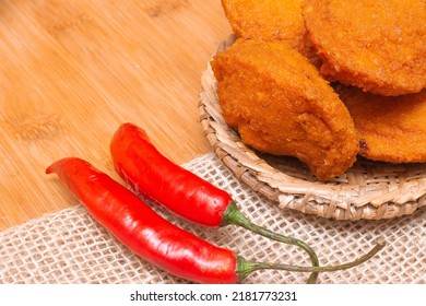 Typical Food From Bahia Called Acarajé Surrounded By Red Peppers And Vatapá