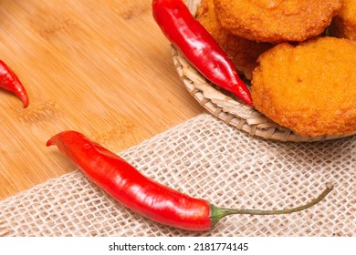 Typical Food From Bahia Called Acarajé Surrounded By Red Peppers And Vatapá