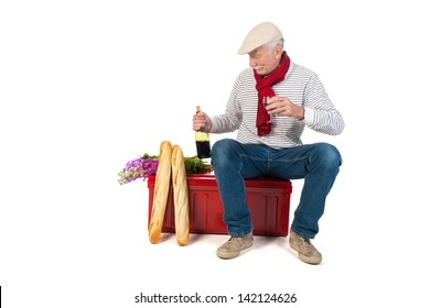 Typical French Man With Bread And Wine Isolated Over White Background