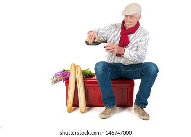 Typical French Man With Bread And Wine Isolated Over White Background