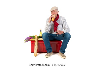 Typical French Man With Bread And Wine Isolated Over White Background