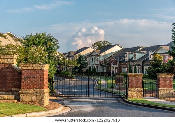 Typical fresh new gated community entrance in\
United States southern\
states