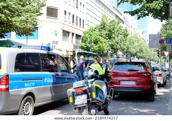 typical german police cars, motorbikes on streets of\
germany, frankfurt am main law enforcement officers guarding order\
on vehicles, demonstrations, rallies, investigating crimes,\
Frankfurt - May 2022