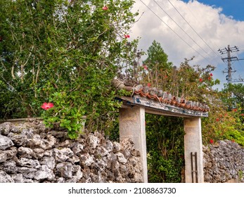 Typical House Entrance In Yaeyama Islands, Japan . Coral Stone On House Wall In The Island