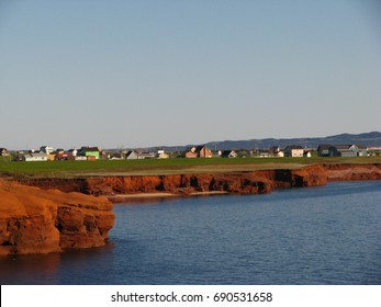 Typical Houses On Top Of Red Cliffs In Magdalene Islands, Iles De La Madeleine, Quebec, Canada