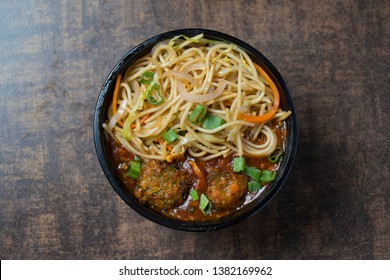 Typical Indian, Chinese Restaurant Dish Preparation. Veg Manchurian With Hakka Noodles. 