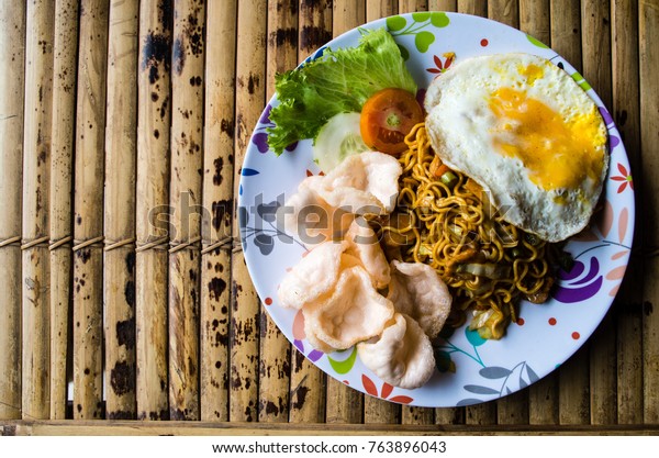 Typical Indonesian dish mie goreng copy space left.