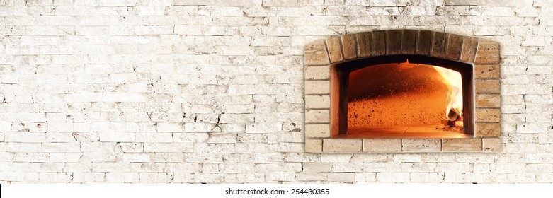 Typical Italian Oven For Bread And Pizza. Nice Fire Light And Colors. Horizontal Photo With Bricks Texture.