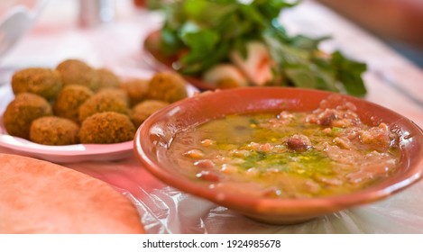 Typical Jordanian Food - Beans, Mint Salad With The Onion, Falafel And Chilli Sauce - Amman - Jordan