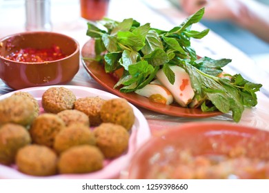 Typical Jordanian Food - Mint Salad With The Onion, Falafel And Chilli Sauce - Amman - Jordan