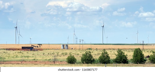 Typical landscape of Texas: endless fields, wind generators, oil pumps, rare green bushes