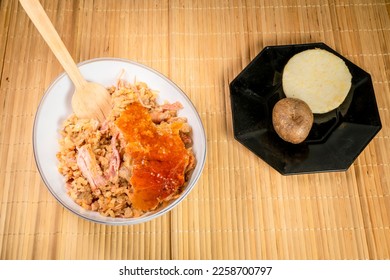 Typical lechona from Tolima with rice - Shutterstock ID 2258700797