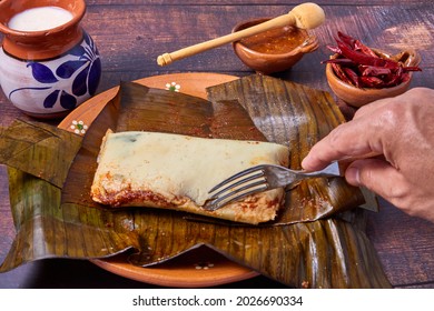 Typical Mexican food, Veracruz or jarochos tamales, prepared with banana leaves, corn flour and red adobo. Prehispanic food, that is, food prepared since before the arrival of the Spanish to America