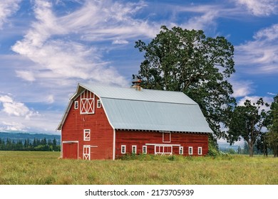 Typical Middle America Red And White Wooden Barn With Beautiful Colorful Sky.