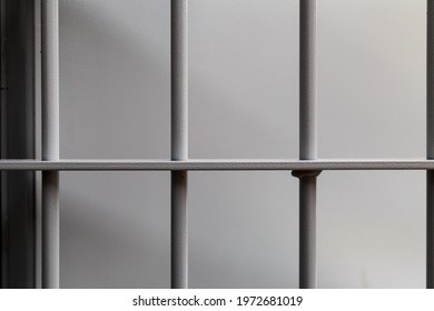 Typical modern prison bars. Symbolic illustrative background for crime news.
