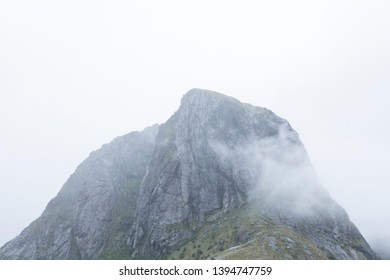 Typical Mountian Ridge Surrounded By Fog In Lofoten Islands, Norway, Scandinavia. 