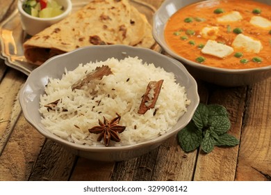 Typical North Indian Meal - Jeera Rice Along With Mattar Paneer And Roti, Shallow Depth Of Field