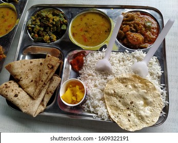 A Typical North Indian Thali Consisting Of Multiple Bowls Full Of Vegetables And Curries. Complete Meal Food Served In The Hostel Canteen.