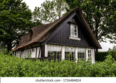 A Typical Old Danish House With A Thatched Roof