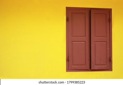 A typical old window and yellow wall in an Indian Village 